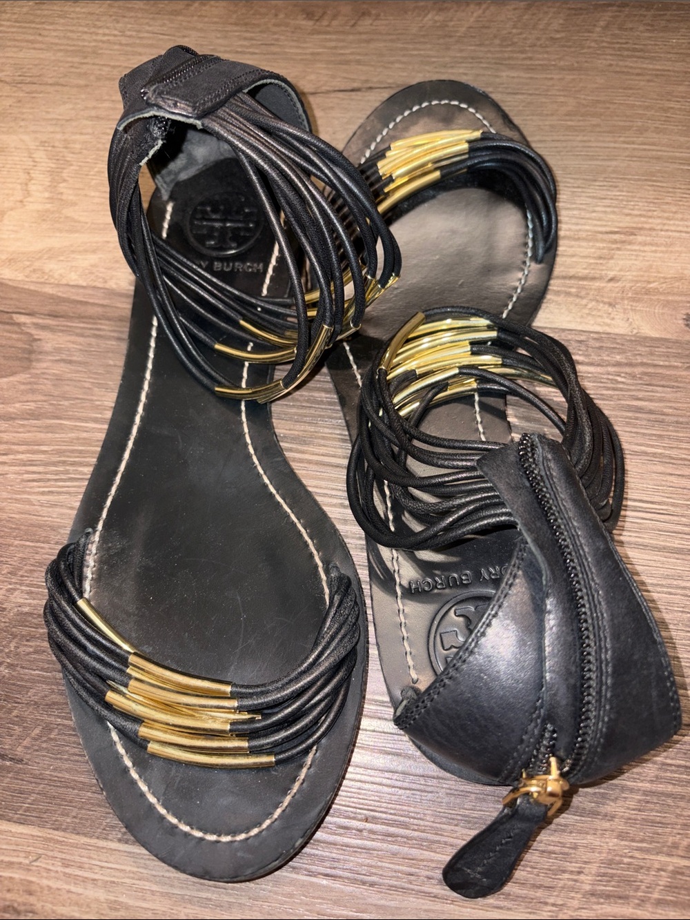 Tory Burch Black Leather Gladiator Sandals with Gold Tubular Accents